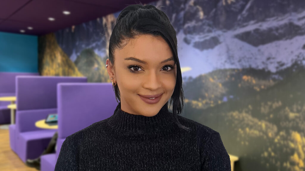 Staff member Alicia smiling in the office