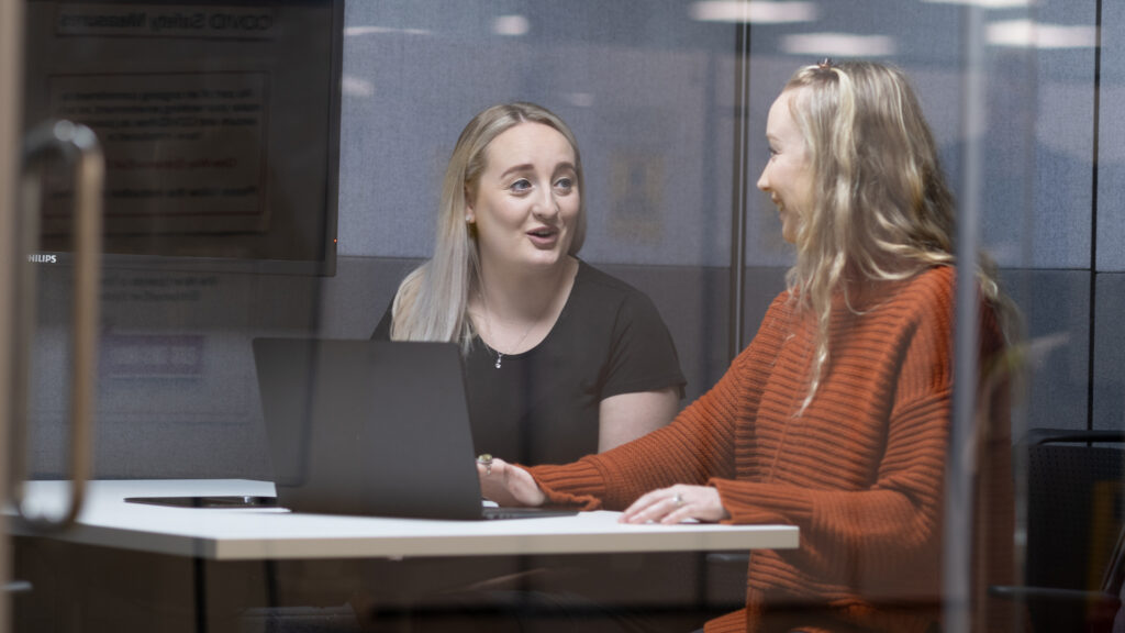 Two female staff members in a meeting
