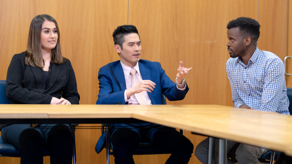 Three members of Home Office staff in a meeting