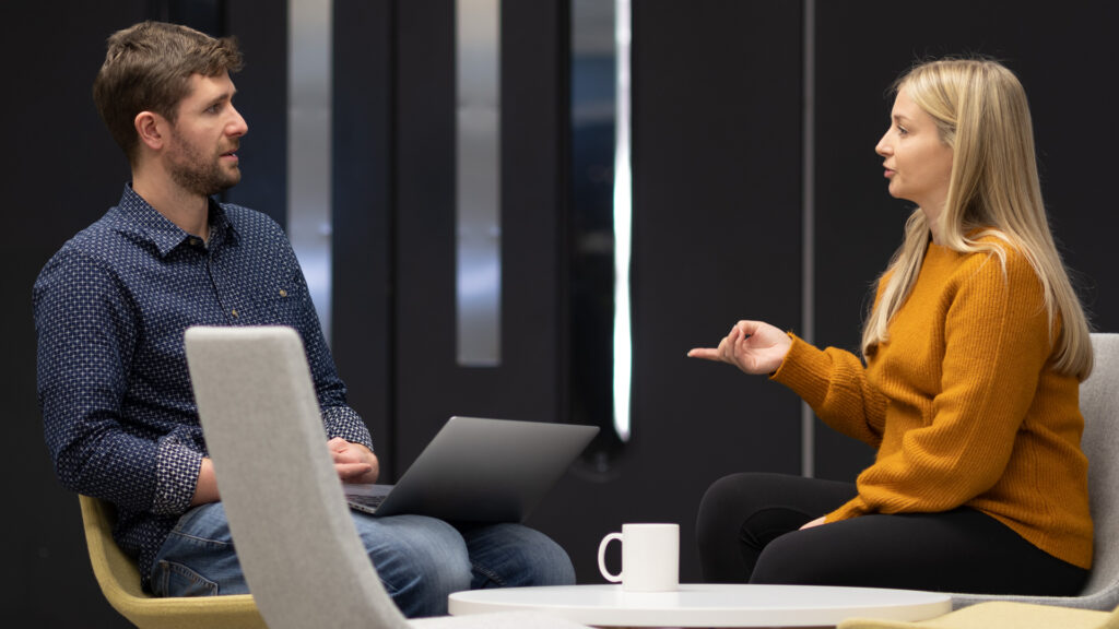 Two Home Office staff in an informal meeting